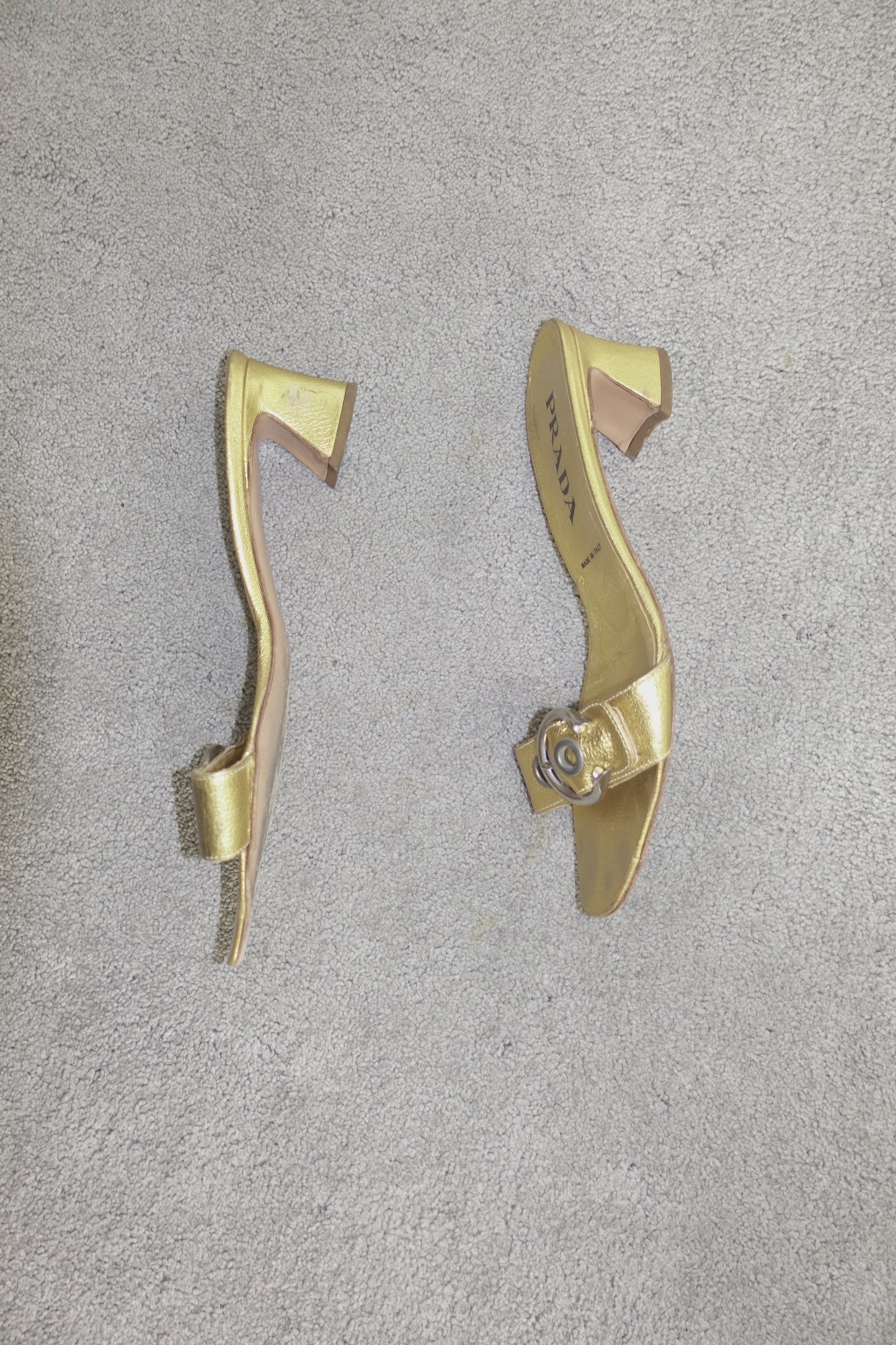 Prada gold buckle mules