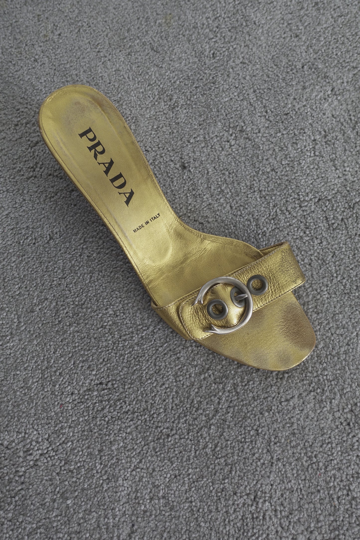 Prada gold buckle mules