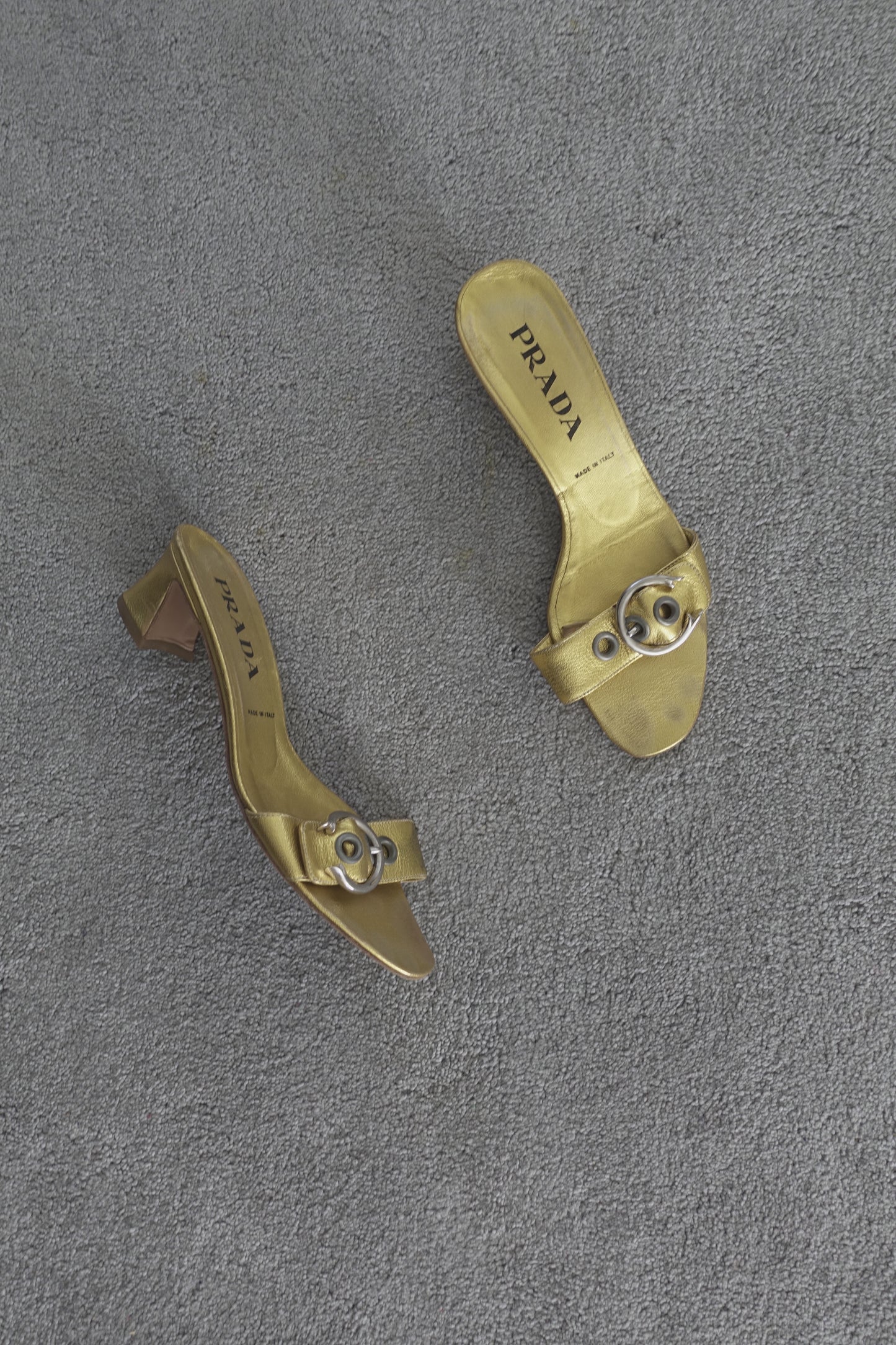 Prada gold buckle mules