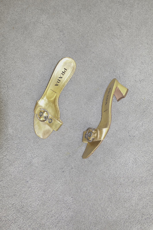 Prada gold buckle mules